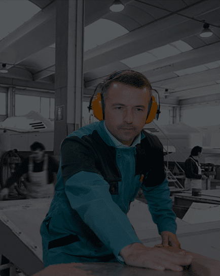 Man with sound cancelling headphones in the Uniesse Workshop